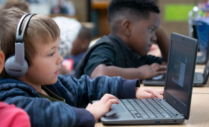 Children using laptops.