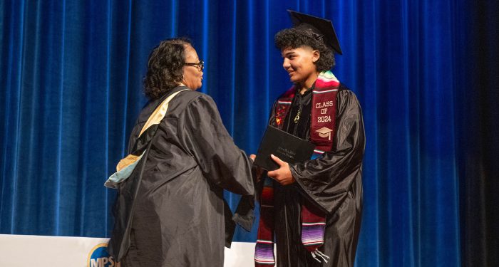 A student receiving their diploma.