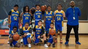 Basketball team with their coach.