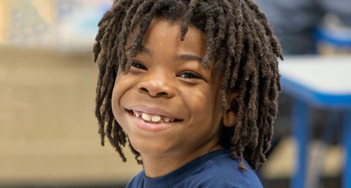 Close-up of a smiling boy.