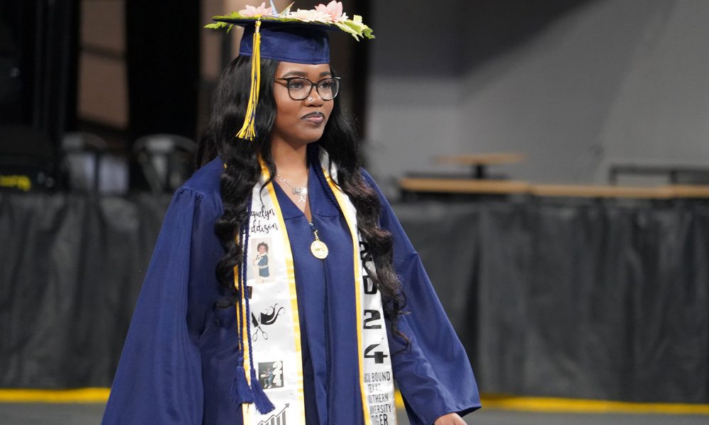 A graduate enters the ceremony.
