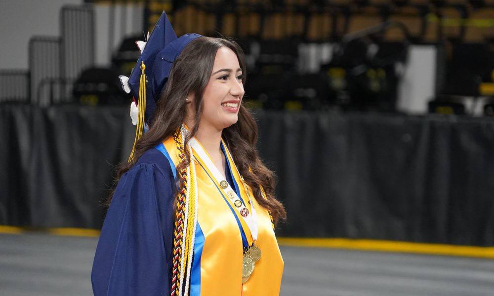 A graduate entering the ceremony.