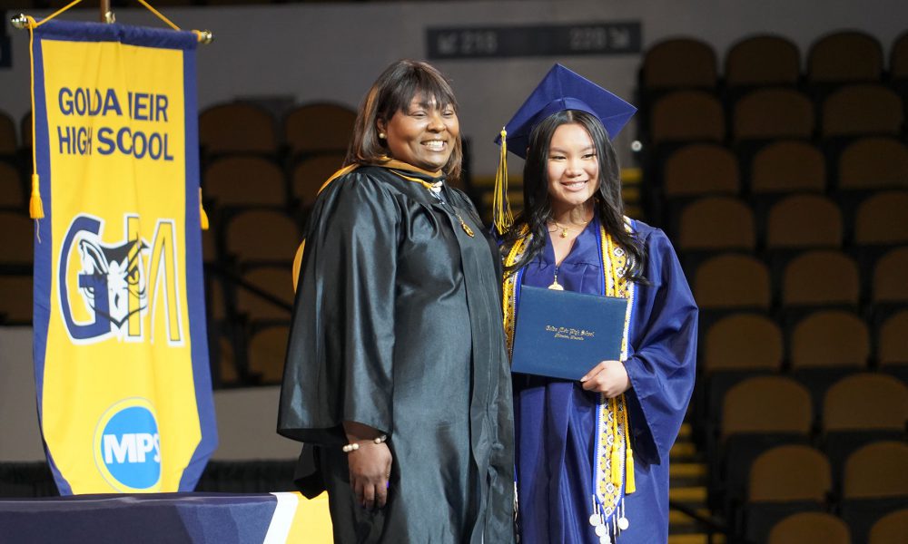 A graduate receives their diploma.