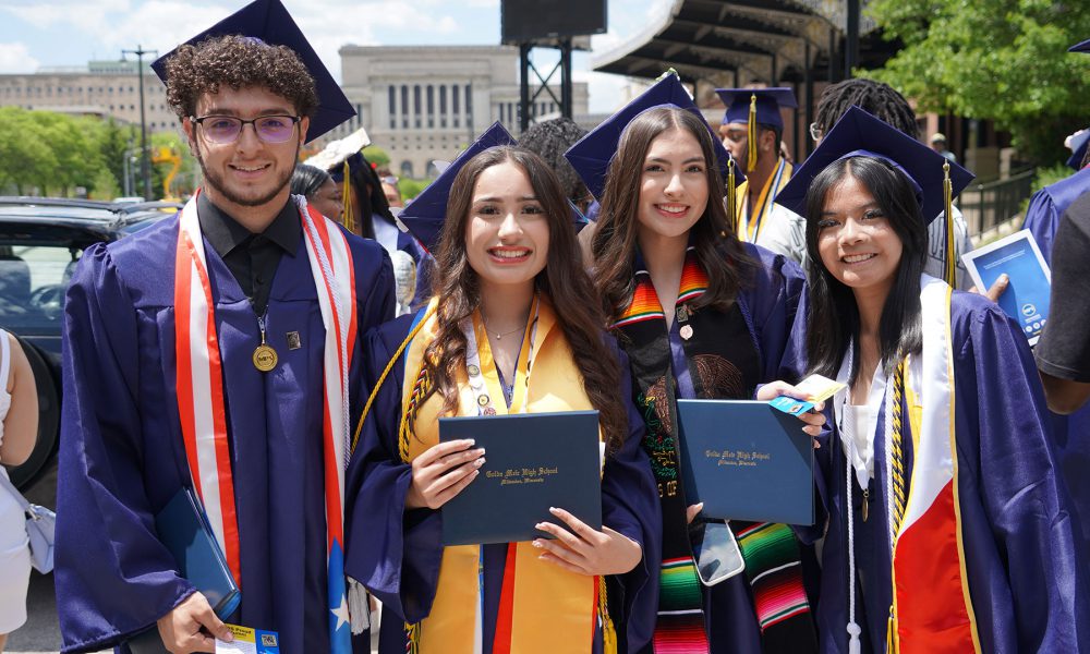 Graduates outside after the ceremony.