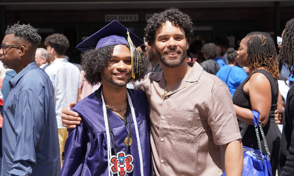 Graduates with their family after the ceremony.