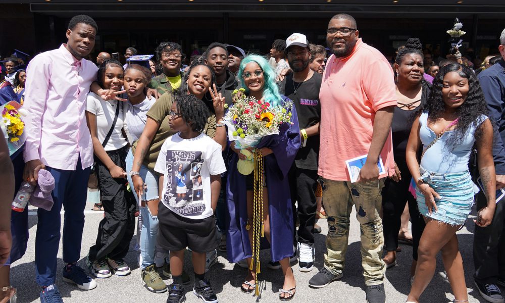 Graduates with their family after the ceremony.
