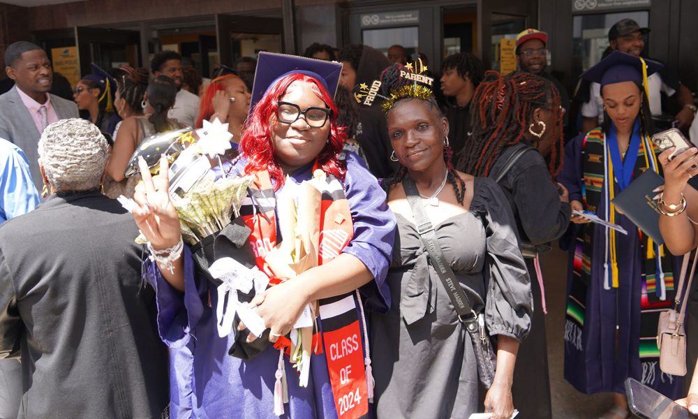 Graduates with their family after the ceremony.
