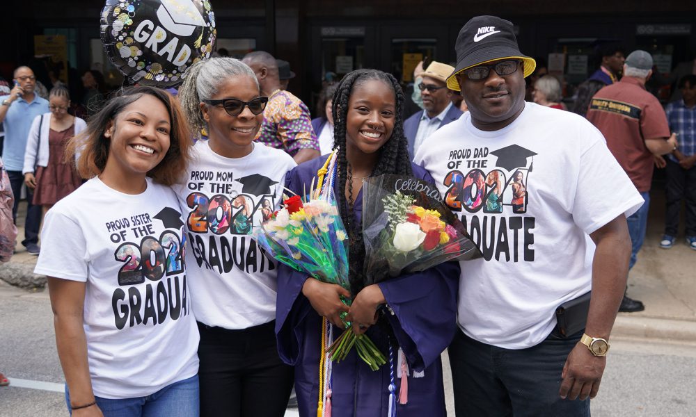 Graduates with their family after the ceremony.