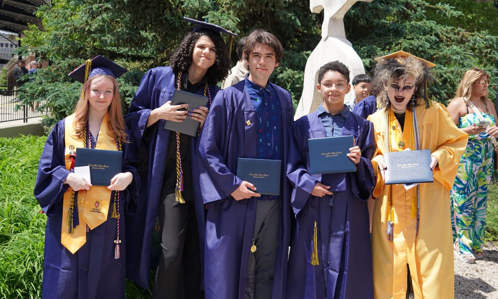 Graduates outside after the ceremony.