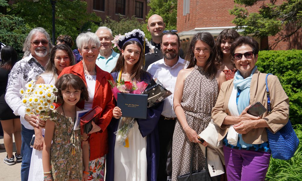 Graduates with their family after the ceremony.