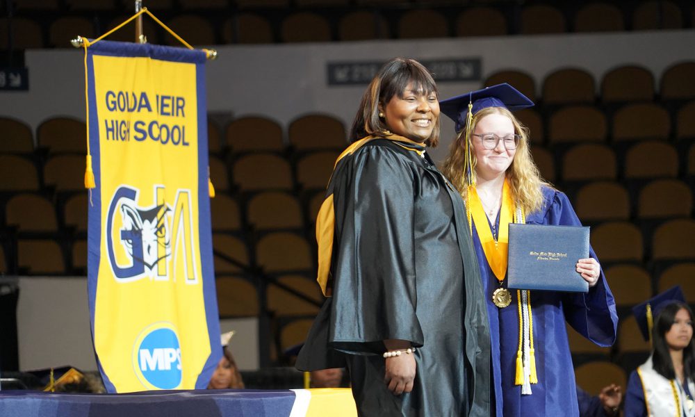 A graduate receives their diploma.