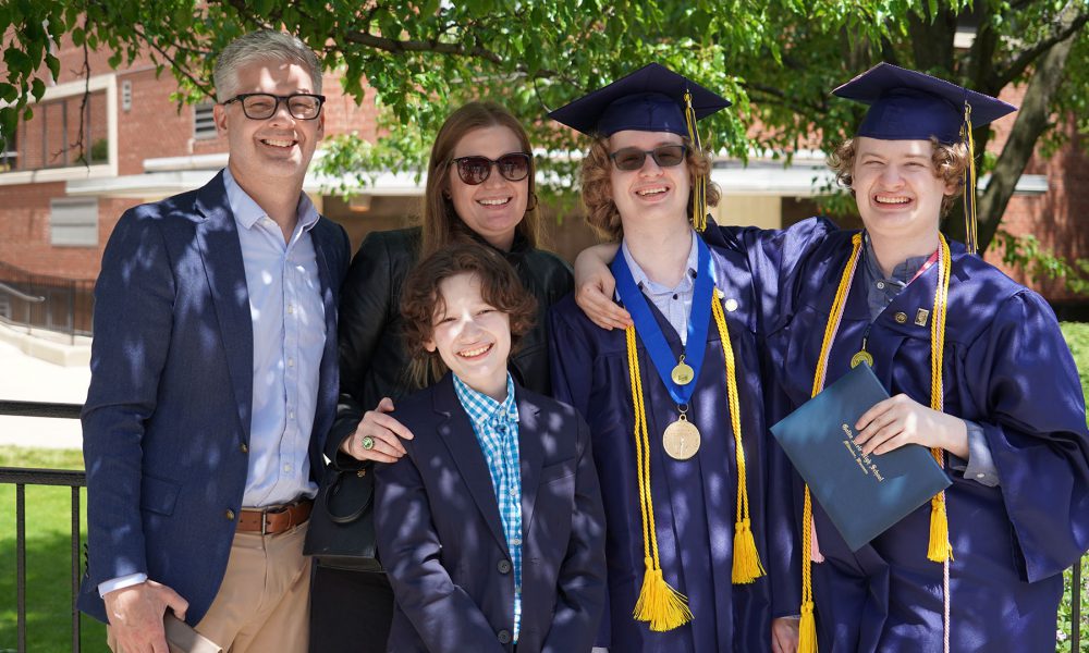 Graduates with their family after the ceremony.