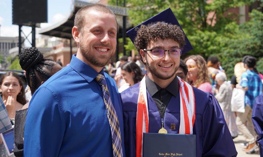 Graduates with their family after the ceremony.