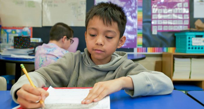 A student using a protractor.
