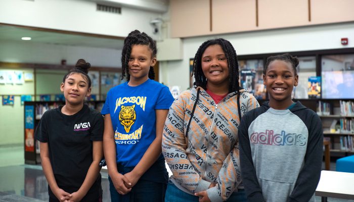 Students lined up in a library.