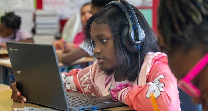 A student using computer.