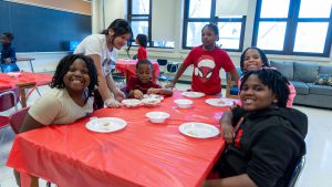 Children at a table ready to eat dumplings.
