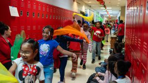 Students in a hallway parade.