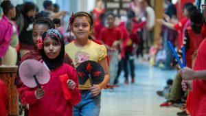 Students in a hallway parade.