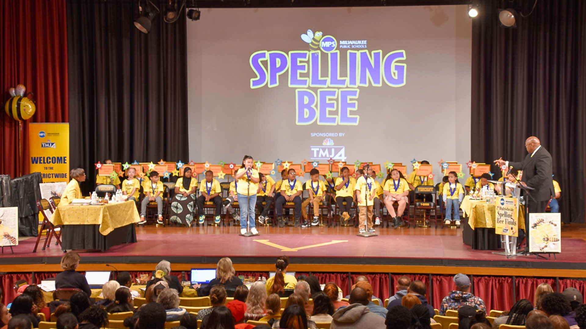 Children on a stage for the spelling bee.