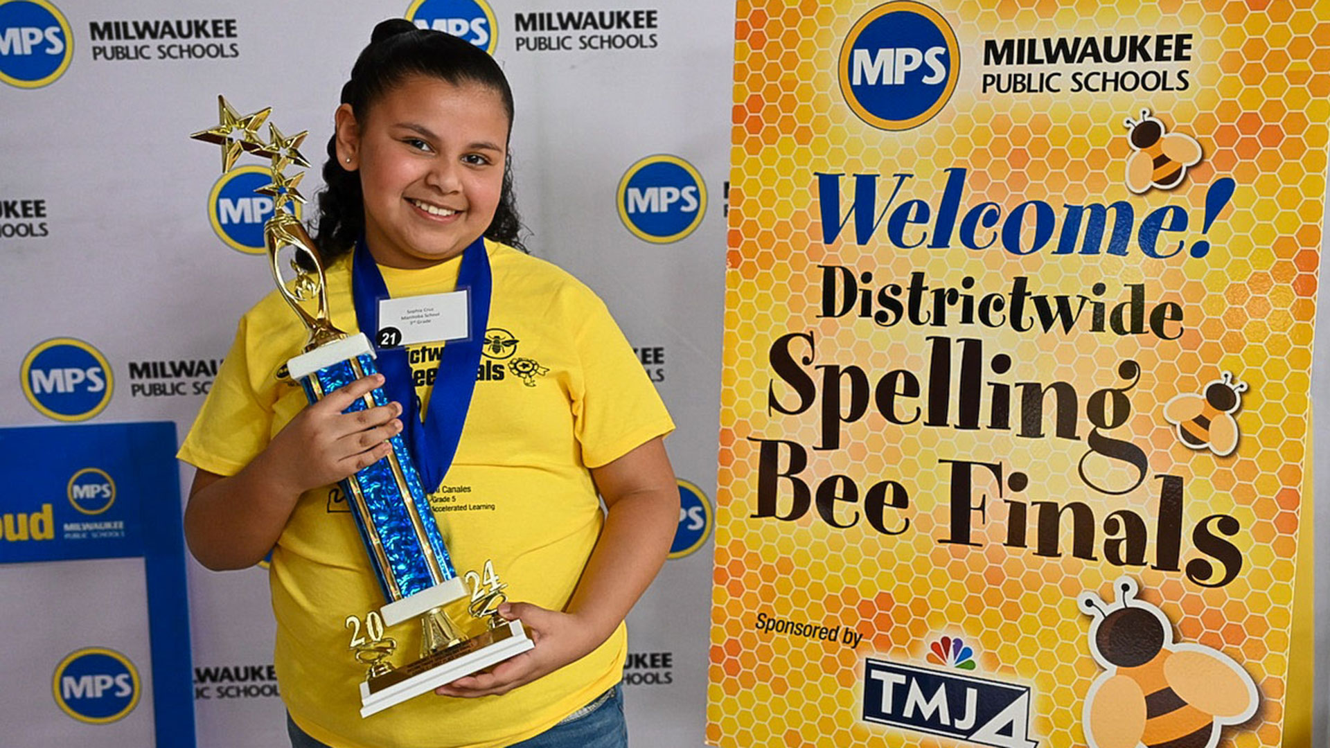 Sophia holding her trophy.