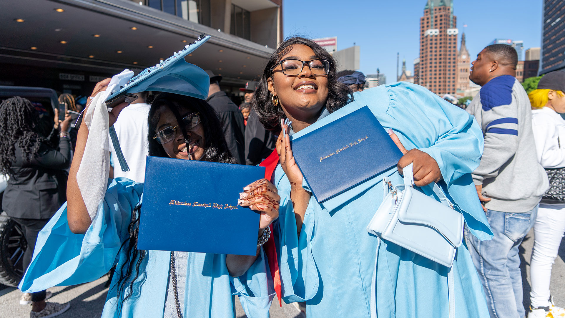Graduates celebrate outside after the ceremony.