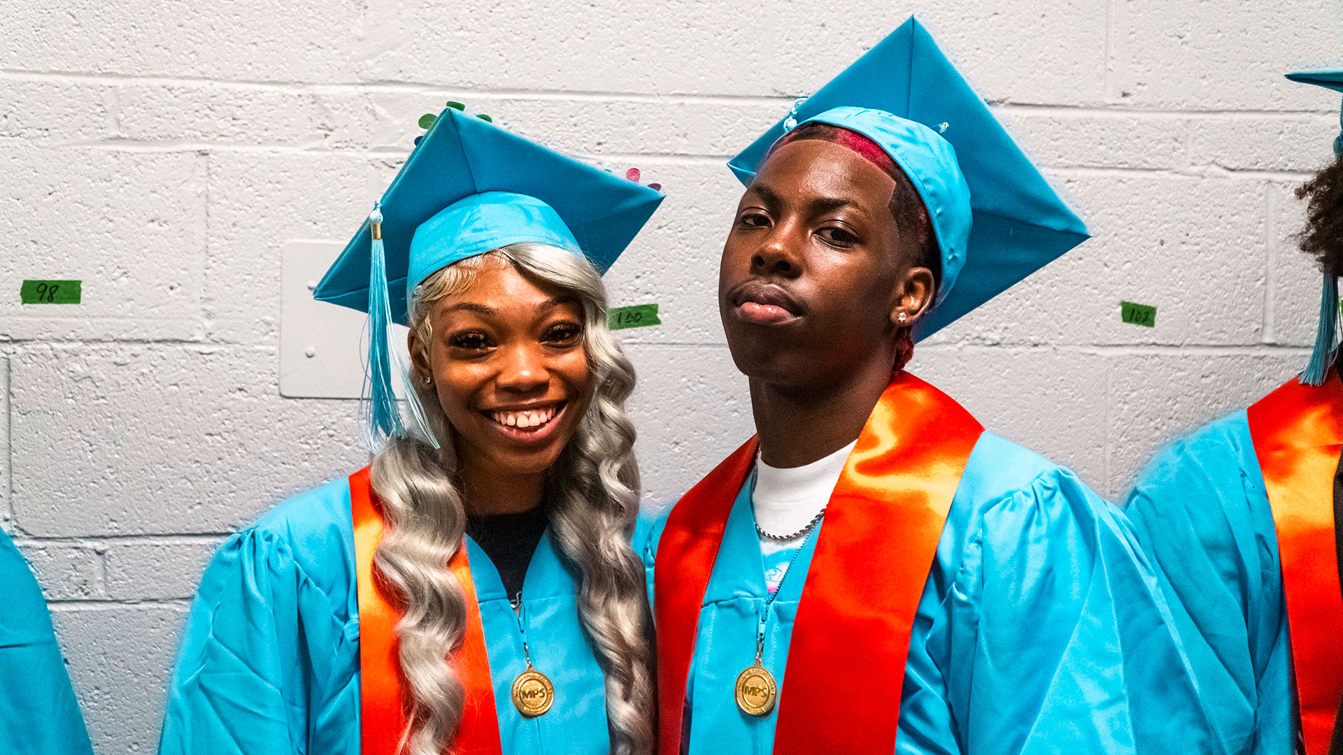 Graduates in the hallway before the ceremony.