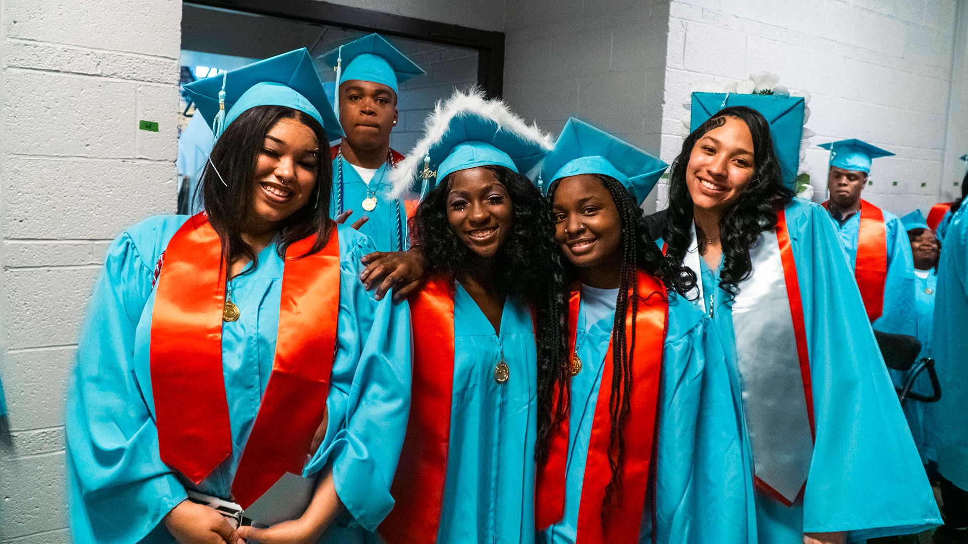 Graduates in the hallway before the ceremony.