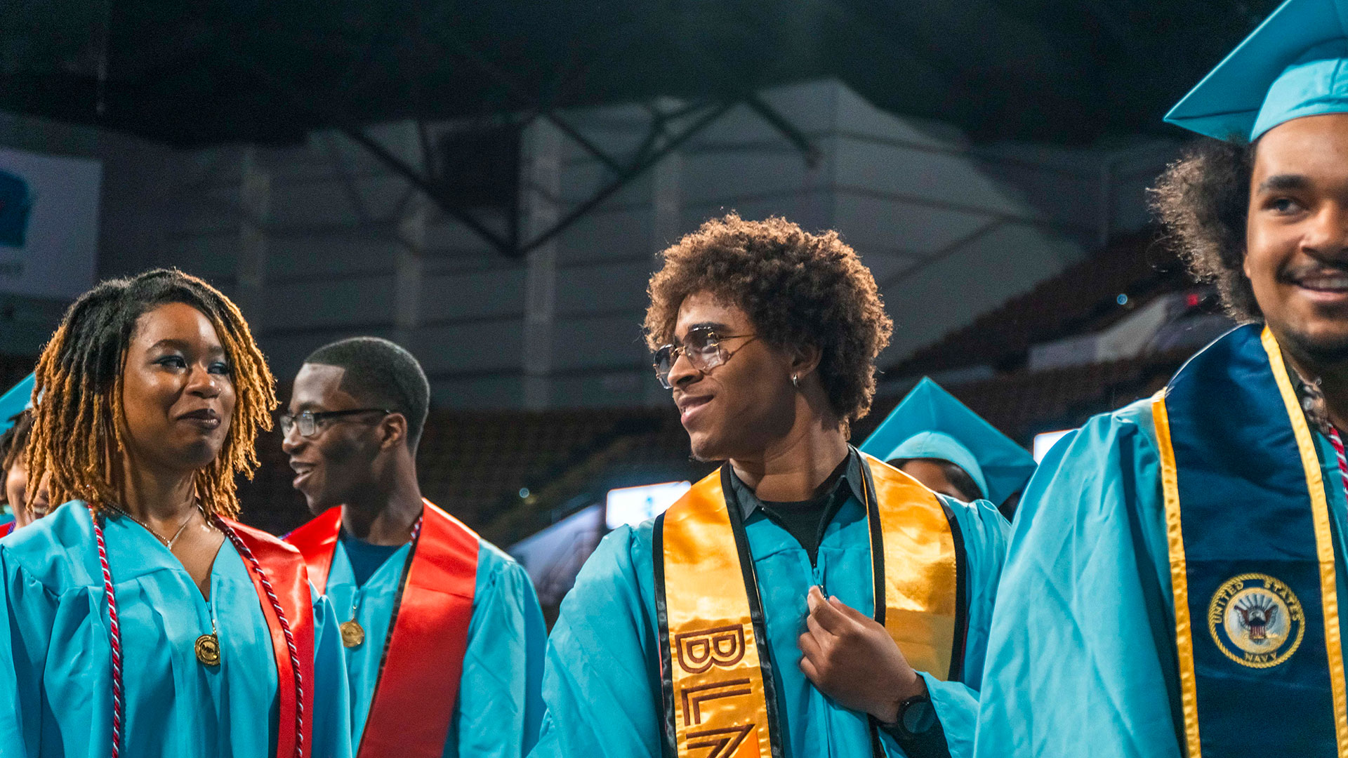 Graduates walking out of the ceremony.