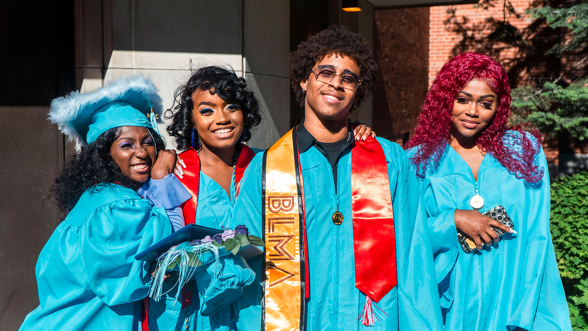 Graduates celebrate outside after the ceremony.