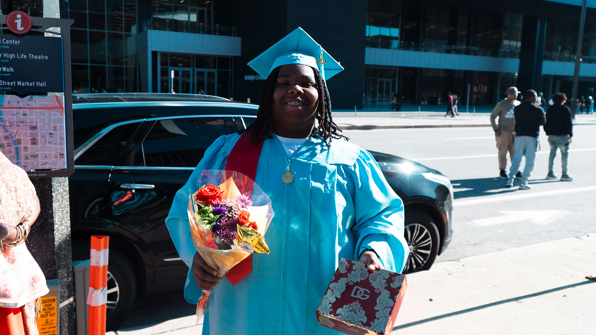 Graduates celebrate outside after the ceremony.