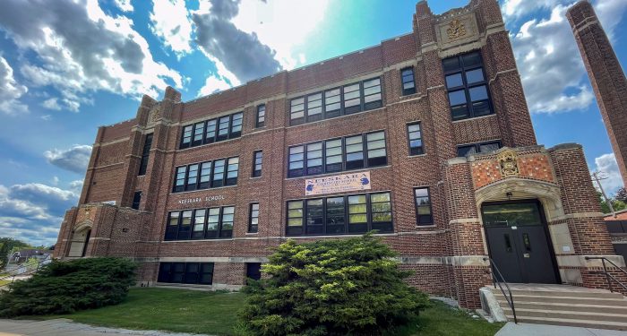 Neeskara School exterior on a sunny day.