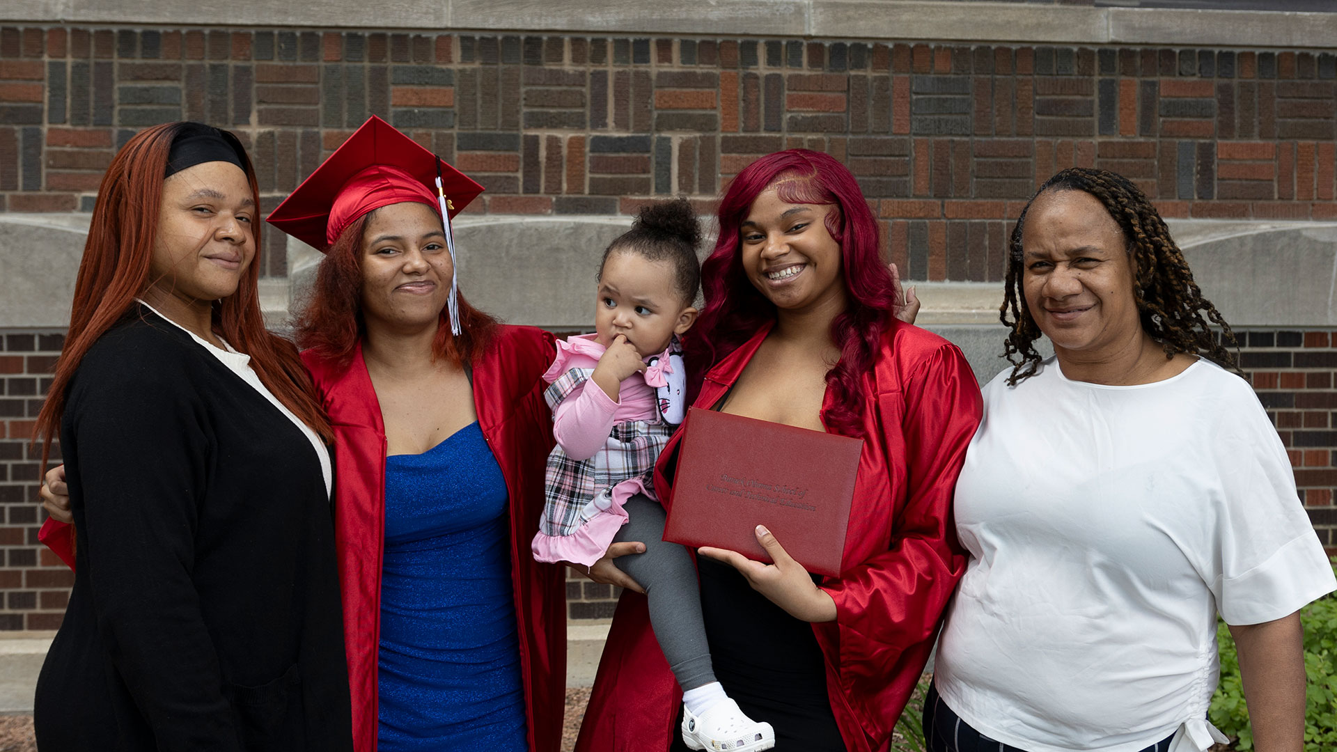 Graduates with their families after the ceremony.