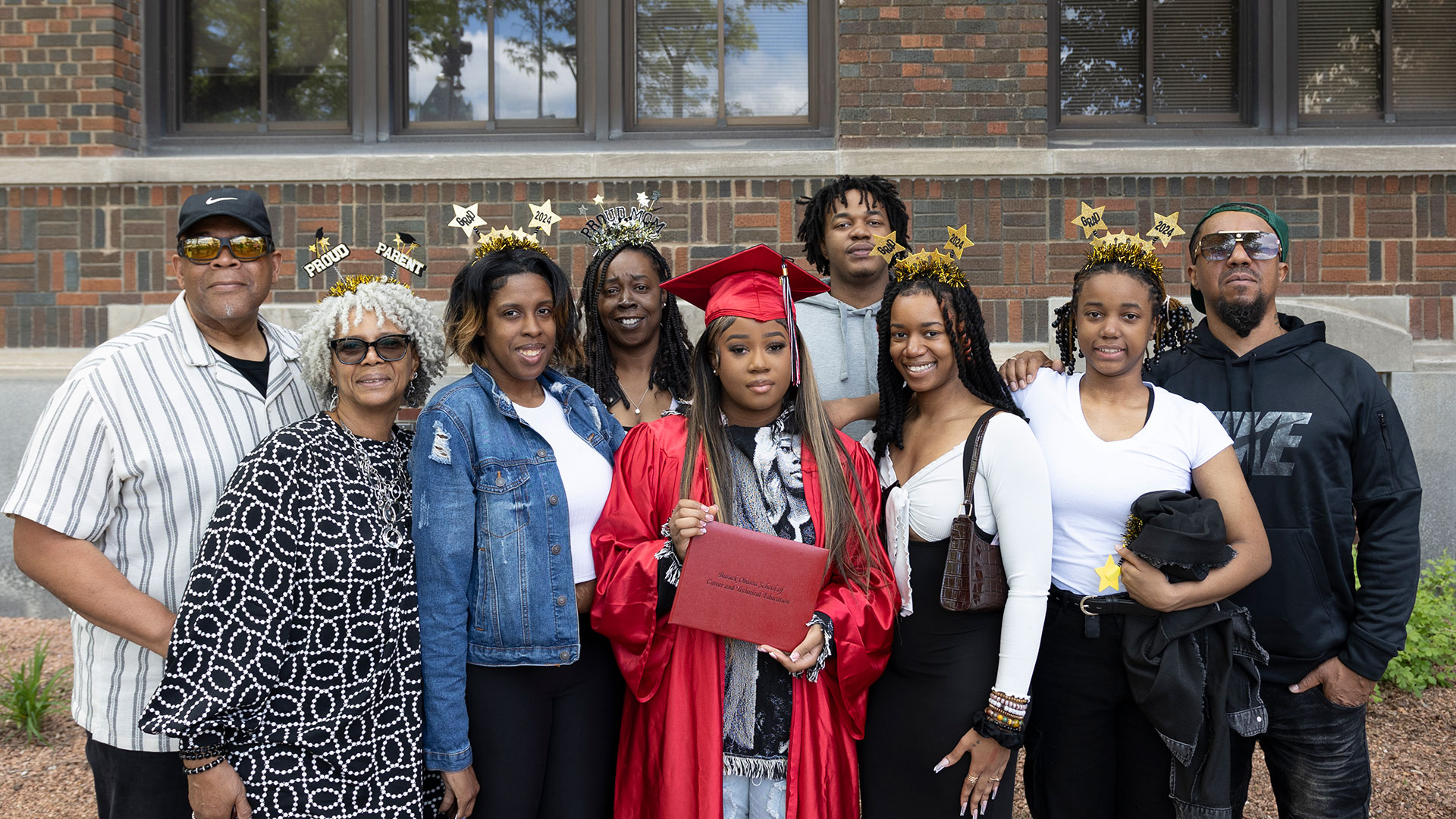 Graduates with their families after the ceremony.