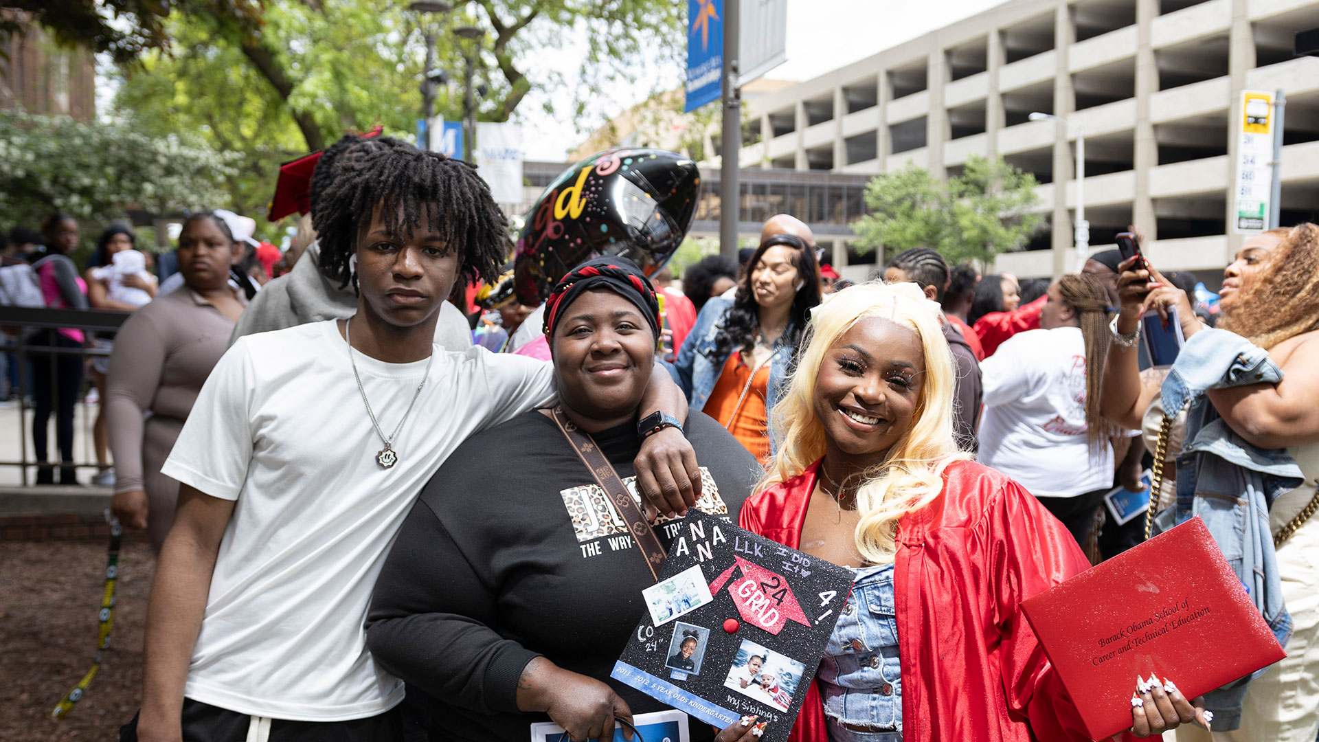 Graduates with their families after the ceremony.