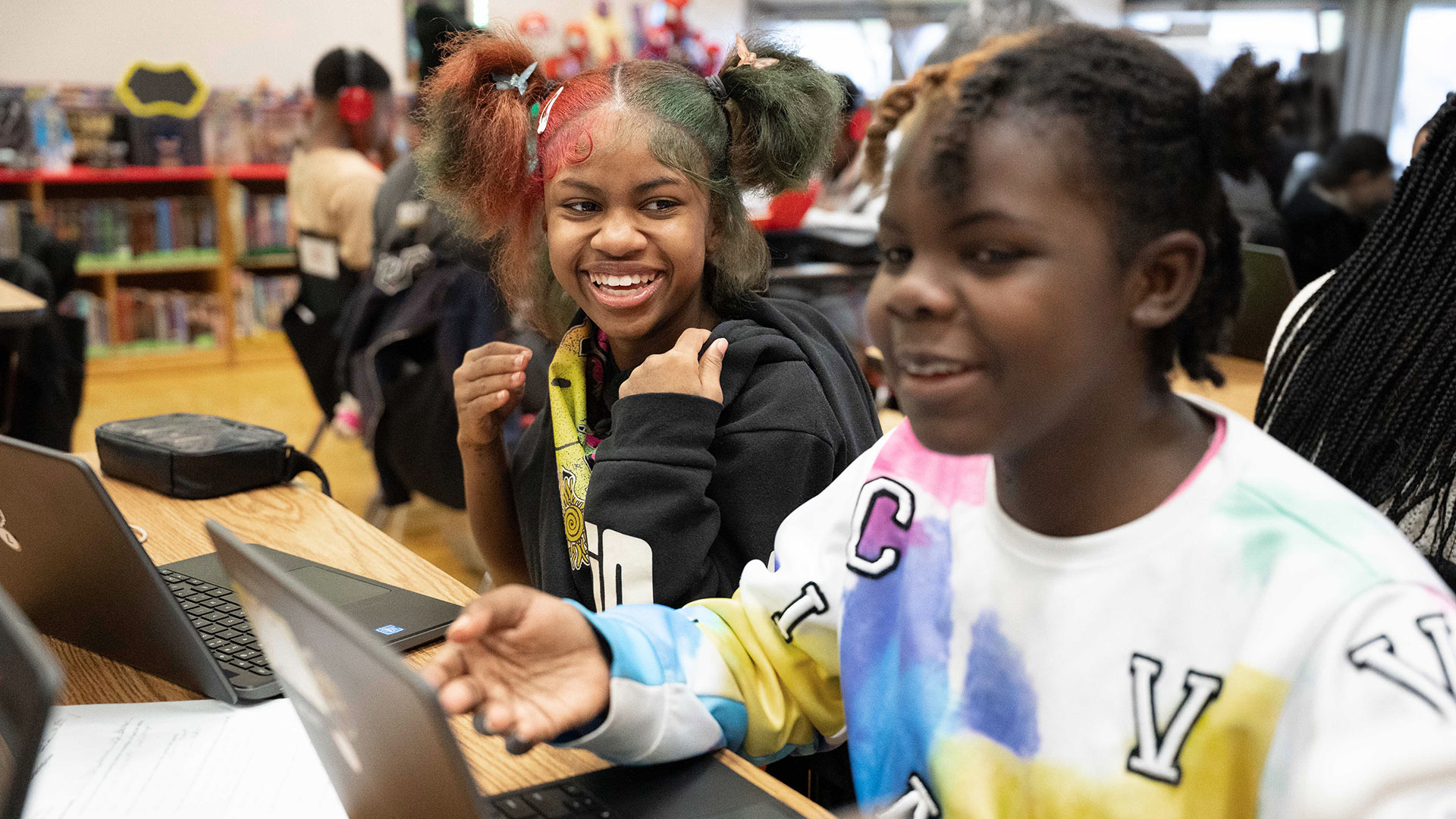 Smiling children in a classroom.