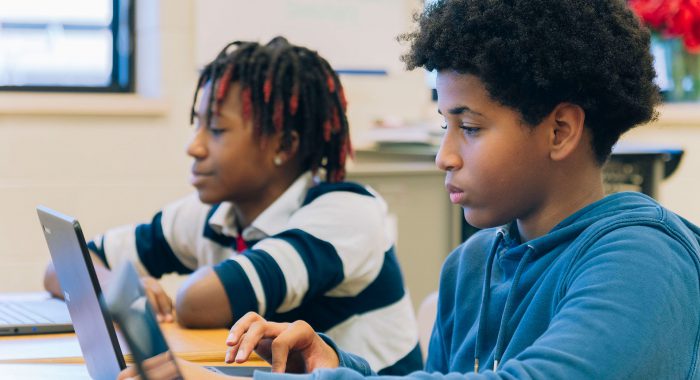 Students using laptops.