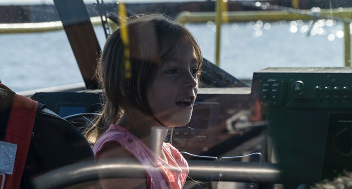 A young girl in a ship at the US Coast Guard Station