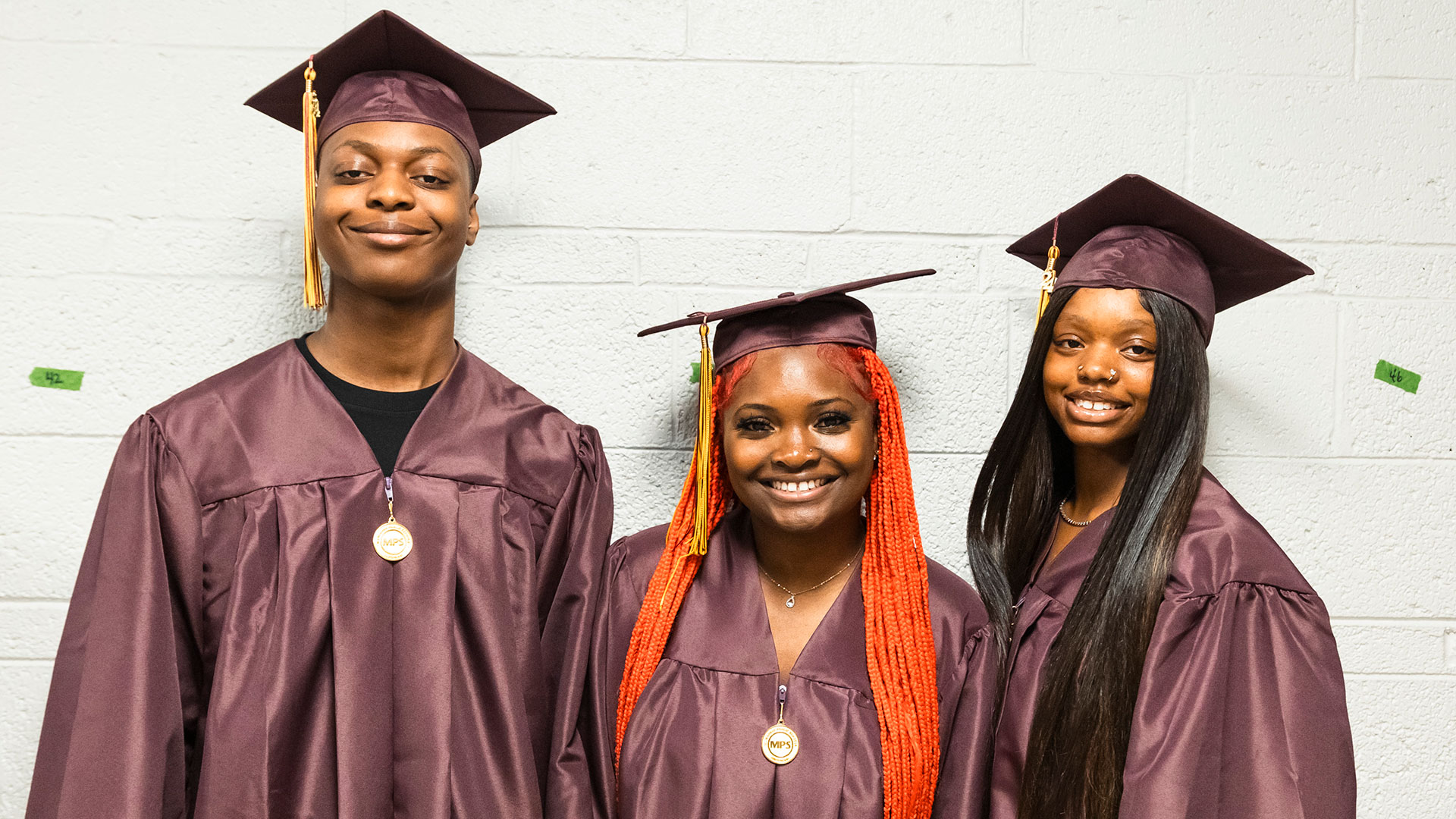 Graduates waiting in the hallway before the ceremony.