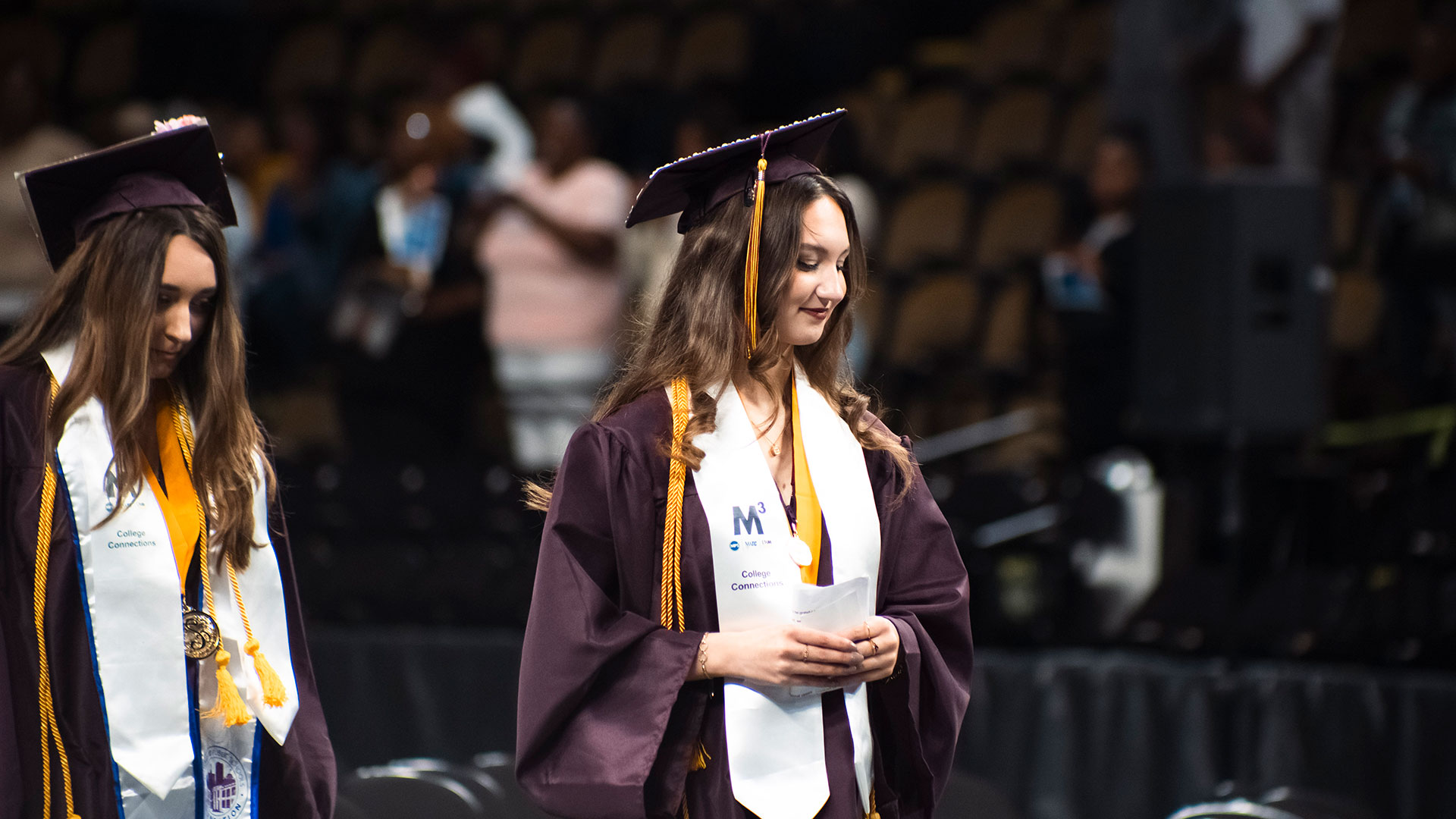 Graduates walking to their seats.