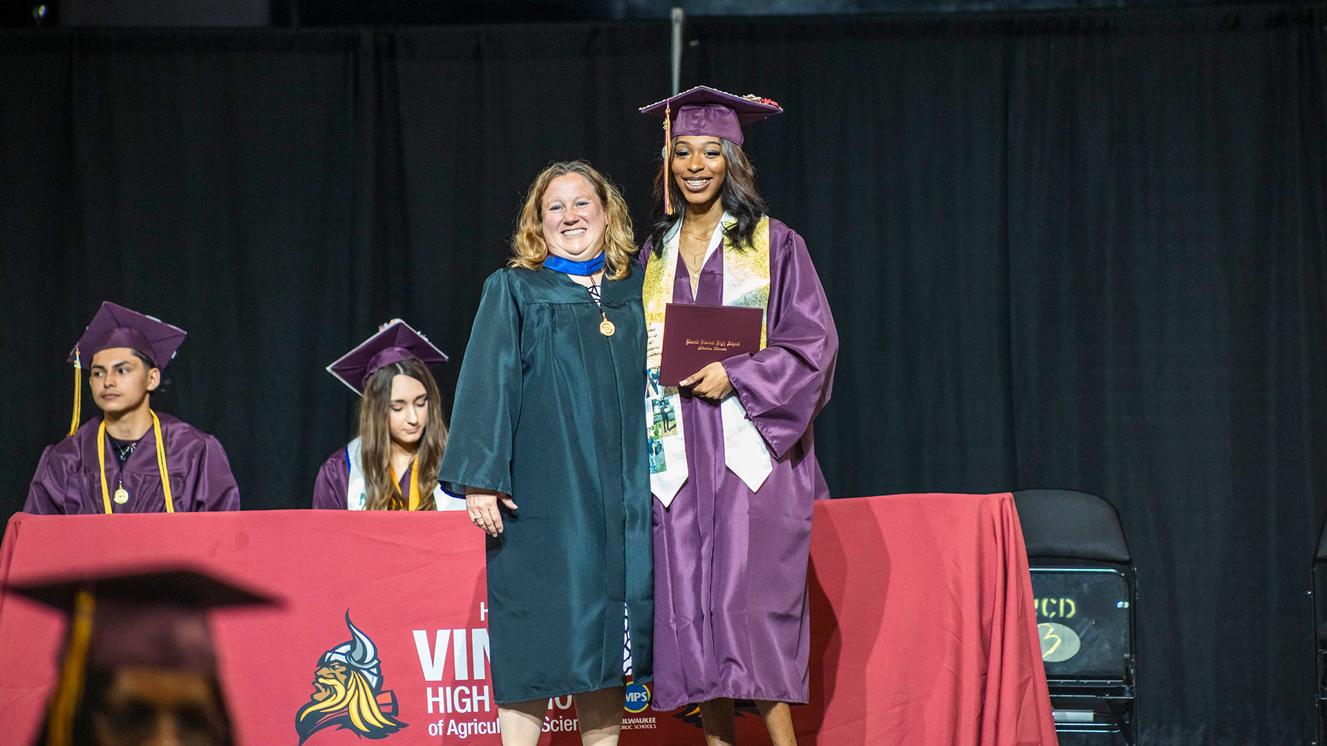 A graduate receiving their diploma.
