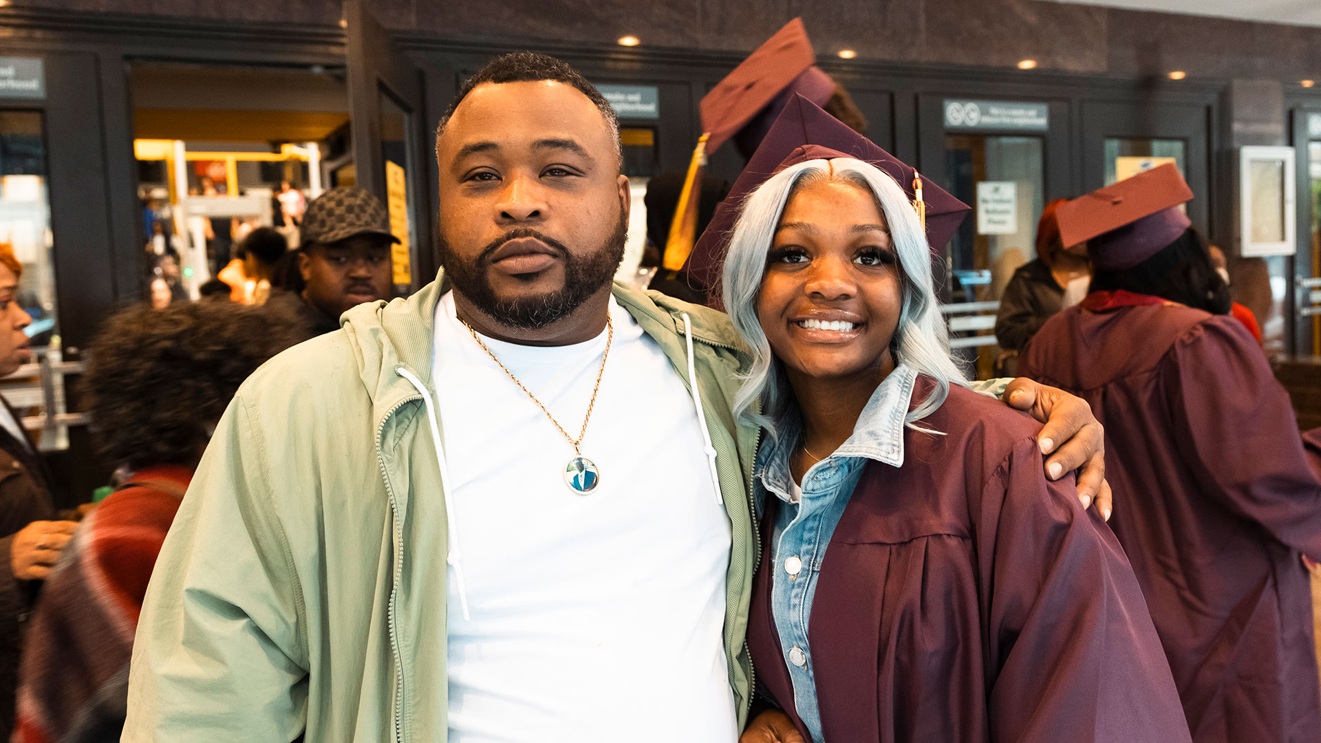 Graduates outside with their families after the ceremony.