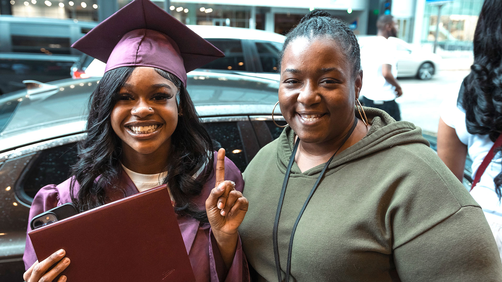 Graduates outside with their families after the ceremony.