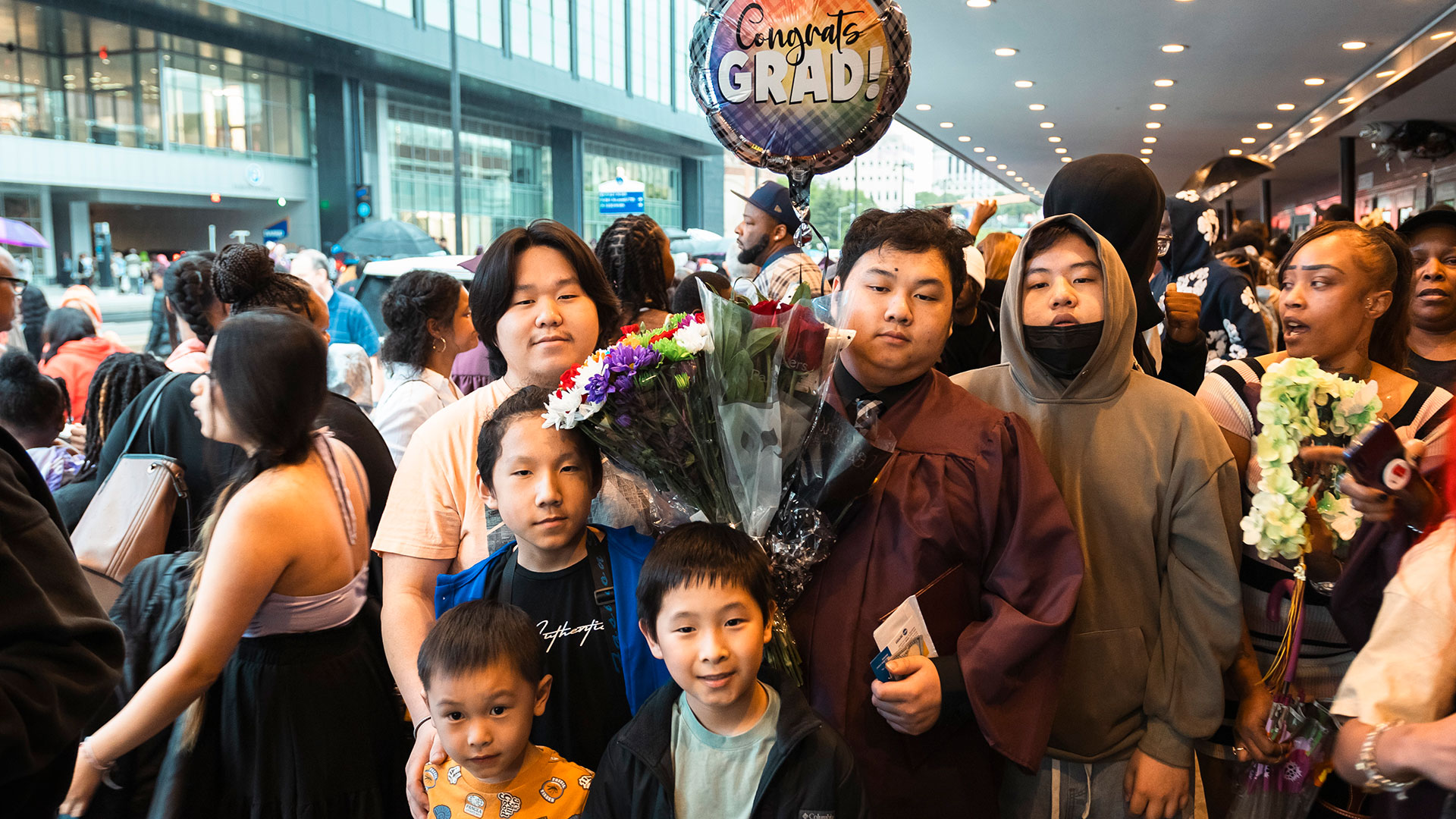 Graduates outside with their families after the ceremony.