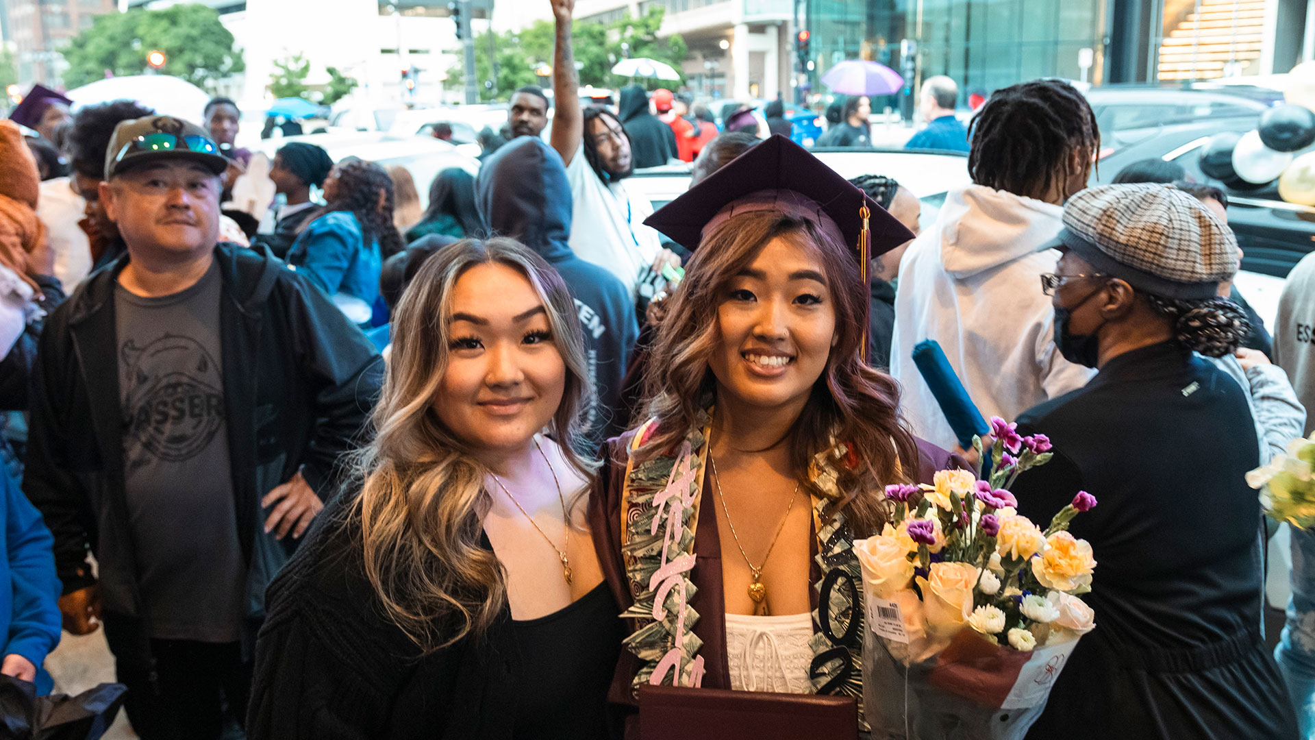 Graduates outside with their families after the ceremony.