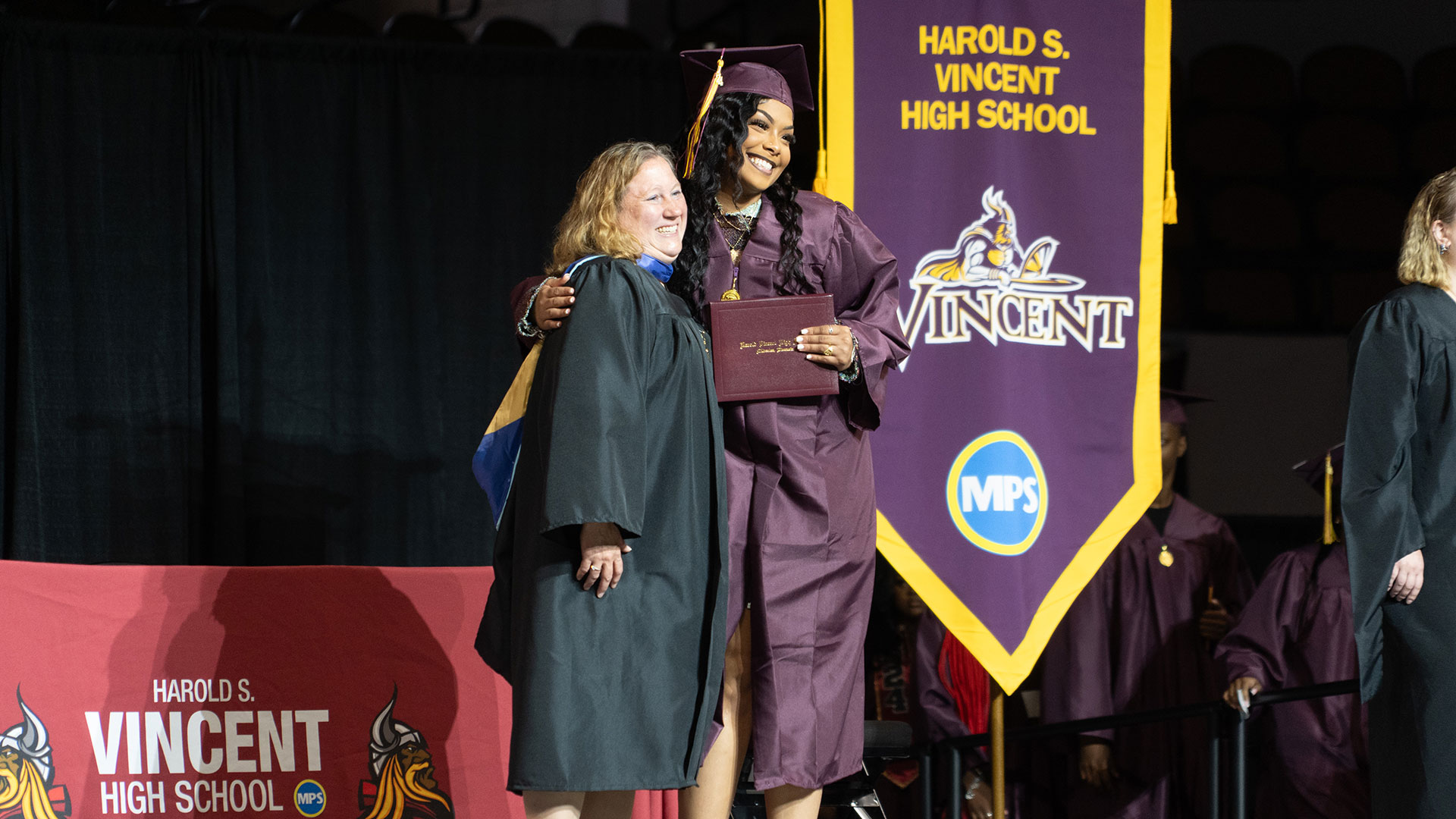 A graduate receiving their diploma.