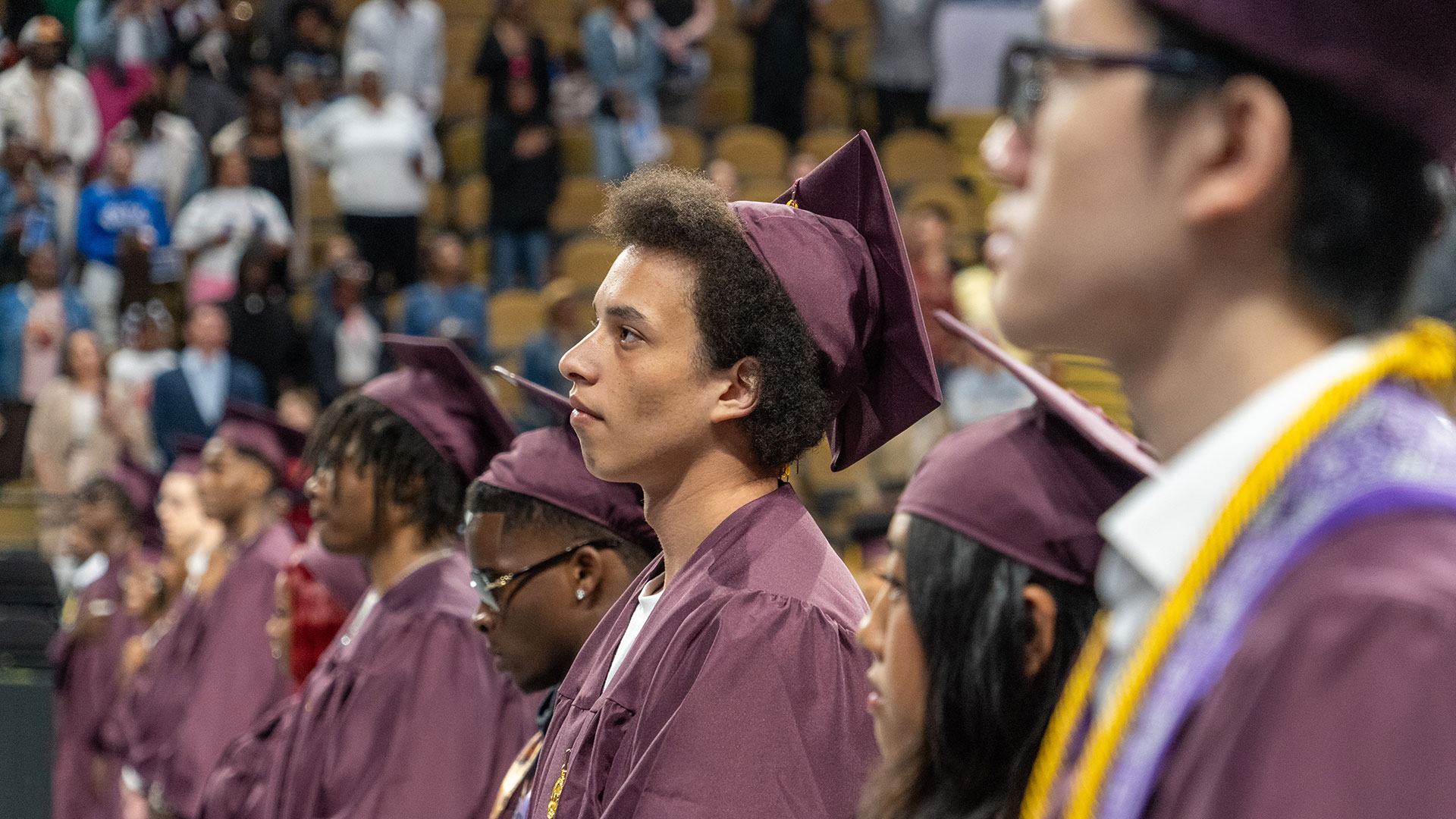 Graduates standing.