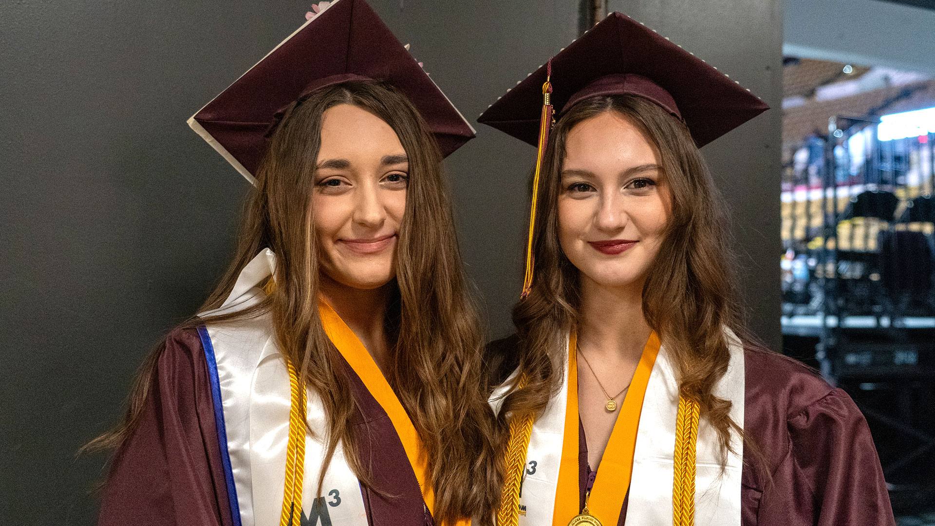 Graduates waiting in the hallway before the ceremony.