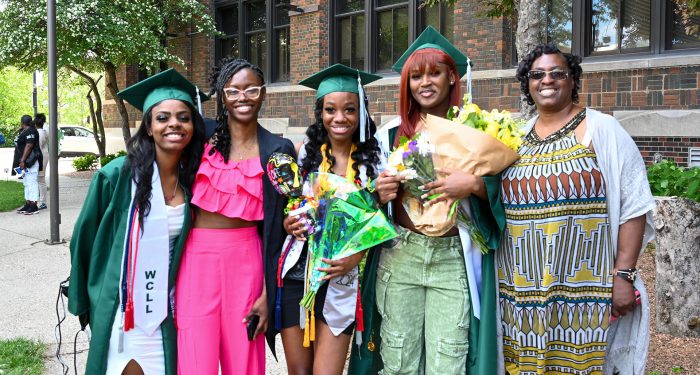 Graduates with their families outside after the ceremony.