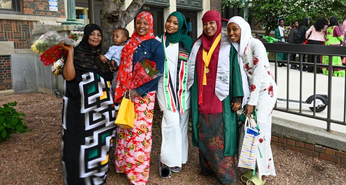 Graduates with their families outside after the ceremony.